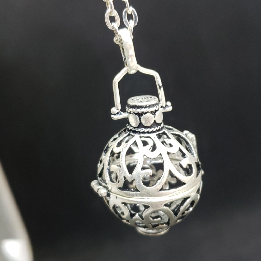 Silvertone cage pendant